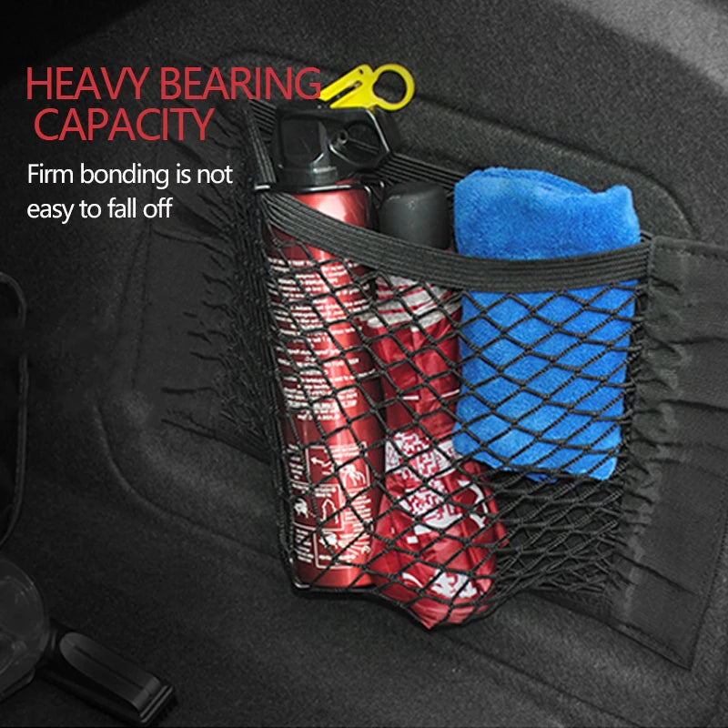 Trunk organizer made of mesh, netting, and pockets.